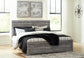 Bronyan King Panel Bed with Mirrored Dresser, Chest and 2 Nightstands